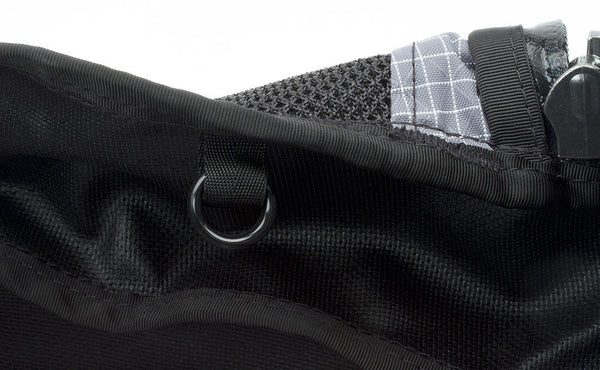 The o-rings are plastic rings that are hung or held in place by a loop of webbing sewn into the seam of the bag.